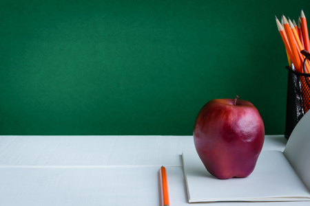 Books Pencil and apple on a white wooden table with skill learning .selective focusの写真素材