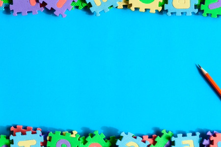 top view jigsaw with toys and children learn education concept