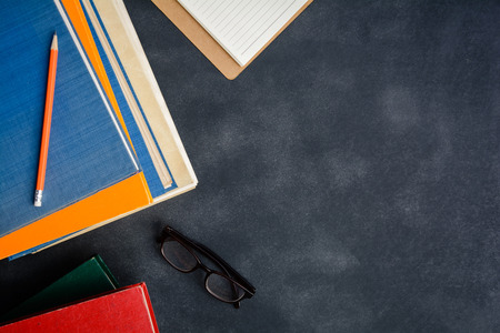 Book glasses and pencil on the desk with study and education concept. selective focus
