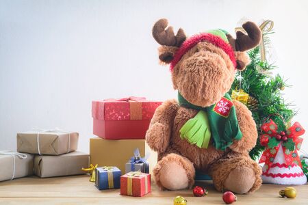Gifts and toys on wooden boards with Christmas holidays and happy smile kids.の写真素材
