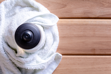 top view white cloth and plastic water bottle on wooden table With exercise to health conceptの写真素材