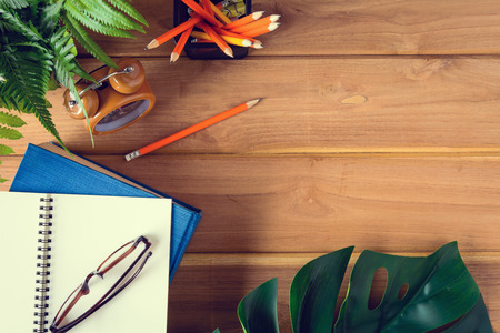 top view book and pencil note on wood table with Desk and learningの写真素材