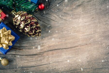 top view gift boxes and ball on the wood table with the holiday season.Festival christmas and snowflakeの写真素材