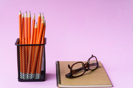 notebook and pencil education and pink background with study noteの写真素材
