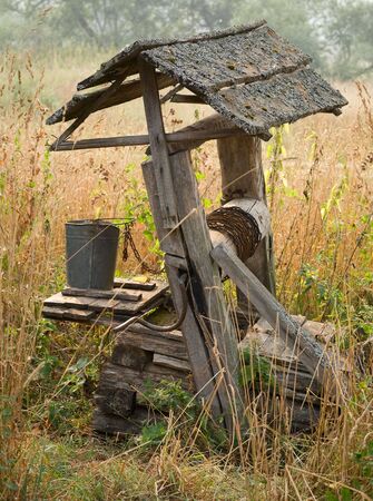 A old water well in village of Russia. A  Misty dayの写真素材