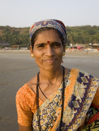 GOA, INDIA - 22 NOV 2011: Portrait of Smiling  Indian female on Arambol beach in Goaのeditorial素材