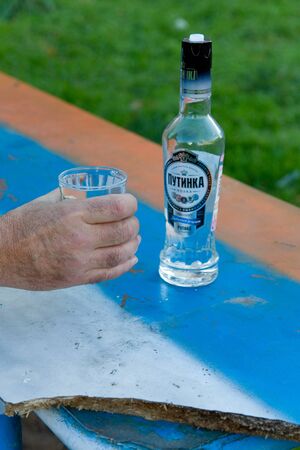 MOSCOW, RUSSIA -  SEP 21,  2011:  picture of russia flag on the table with bottle vodka putinka and glassのeditorial素材