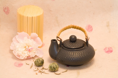 Black teapot with Lotus Flower Chinese tea and flower of peonyの写真素材
