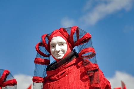MOSCOW - SEPTEMBER 1, 2012: man in red fancy-dress  of harlequin  during a 865 Town Day on September 1, 2012 in Moscow, Russia. のeditorial素材