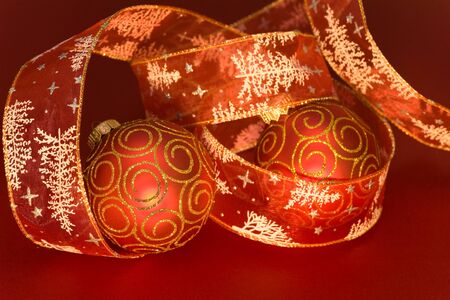 red christmas ball on red background の写真素材