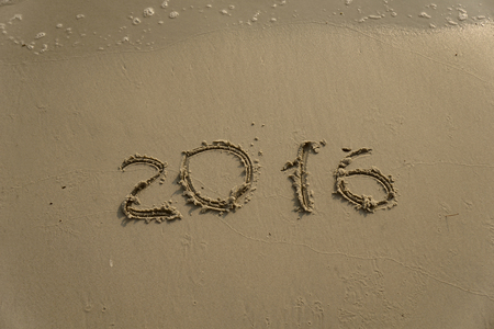 new year numbers 2015 and 2016  drawings in the sand on the beachの写真素材