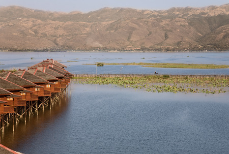 INLE LAKE, MYANMAR - FEB 19, 2011- Dusk, Floating cottages of Hupin Hotel on Inle Lake, Myanmar (Burma) on February 19, 2011のeditorial素材