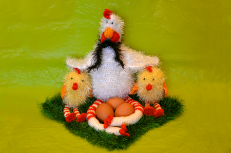 Easter scene with chicken with eggs and two chick   in the spring meadowの写真素材