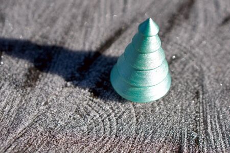 Christmas green tree from wood on wooden   background  with  snow. Christmas and New year decorations or greeting card.の写真素材