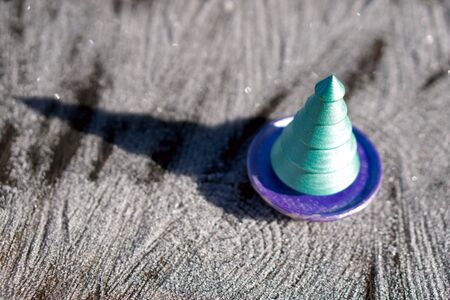 Christmas green tree from wood on wooden   background  with  snow. Christmas and New year decorations or greeting card.の写真素材