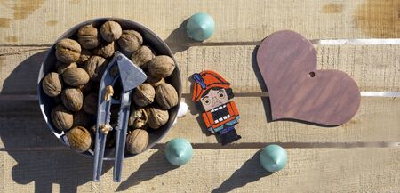 Merry Christmas and  New Year flat lay on a wooden background. Wooden Christmas toys of Nutcracker,...