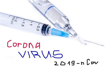 Corona virus treatment concept  with Glass Medicine ampule and Syringe on White Background.の写真素材