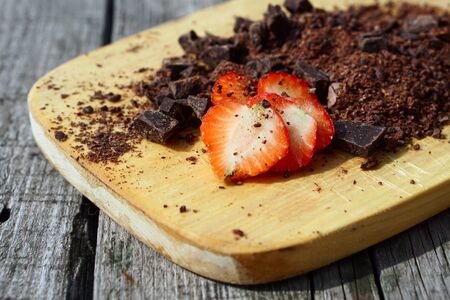  Flat lay  of Raw cocoa beans,  cocoa powder, chocolate on sacking  on wooden  as background, top viewの写真素材
