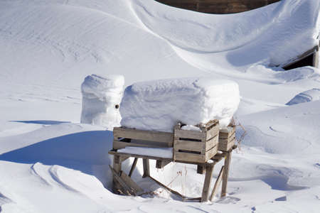 Newly snow as Background with wooden rustic table in gardenの写真素材