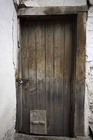 locked old dark wooden doorの写真素材