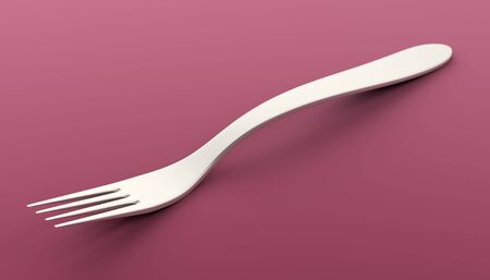 fork on colored satin clothの写真素材