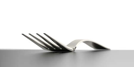 closeup of fork on grey kitchen tableの写真素材