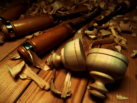 wood carving, carver tool shavings on the workbenchの写真素材
