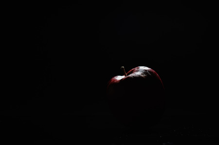 Red Apple On Black Backgroundの写真素材