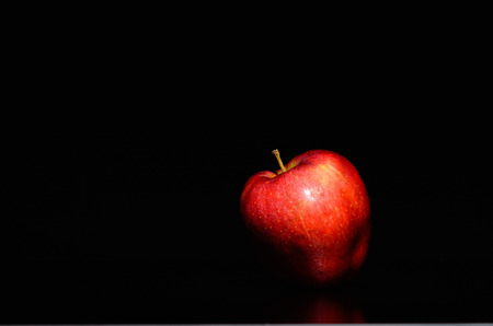 Red Apple On Black Backgroundの写真素材
