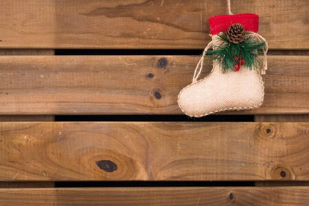 Christmas sock on wooden backgroundの写真素材
