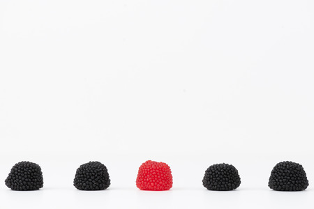 blackberry jelly beans isolated on white blackgroundの写真素材