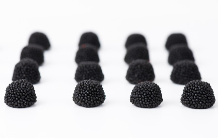 blackberry jelly beans isolated on white blackgroundの写真素材