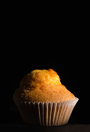 Delicious magdalene over black background. Sweet typical spanishの写真素材