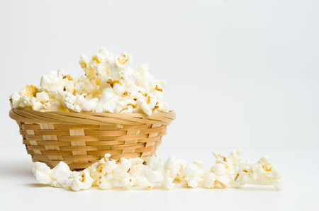 popcorn in basket  on white backgroundの写真素材