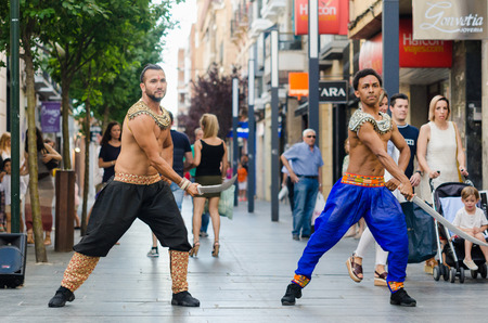 Badajoz, Spain - june 09 2017: Two man bollywood dancers performing in the streets Menacho of...