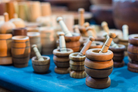 Handmade wooden mortars in market on medieval festival