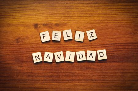 Feliz Navidad text on a wooden backgroundの写真素材