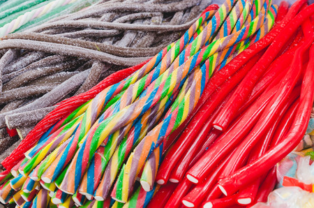 Long sweet coloured candiesの写真素材