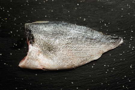 ready to cook fillet of  raw bream fish with saltの写真素材