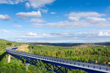 Highway bridge over extremadura forest in landscape, sunny summer day.の写真素材