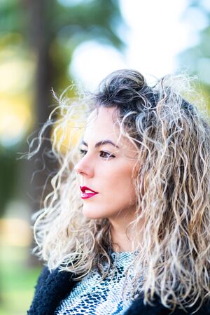 headshot of caucasican beautiful woman with curly hairの写真素材