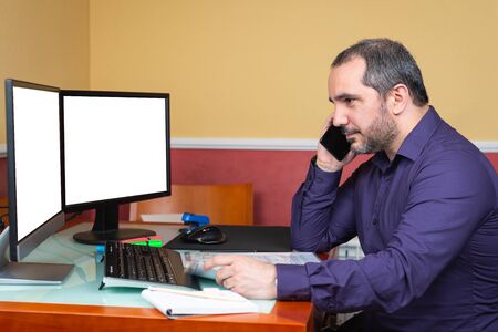 man teleworking and using smartphoneの写真素材