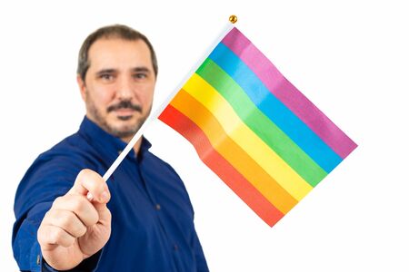 man holding lgtb flag on white backgroundの写真素材