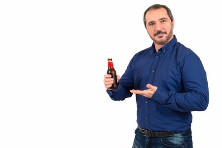 man showing a bottle of beer on white backgroundの写真素材