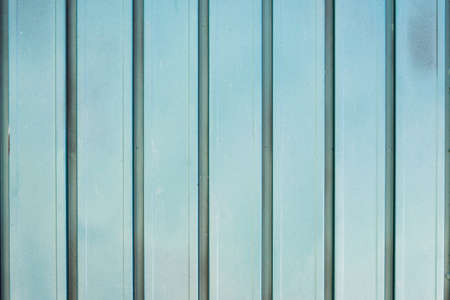 Background of blue metal door in grungy style.の写真素材