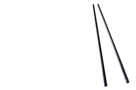 View of black chopsticks isolated on white backgroundの写真素材