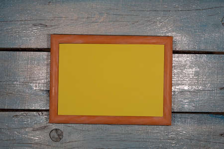 Background, texture. Close-up. On a plank painted background is a horizontally light brown picture...