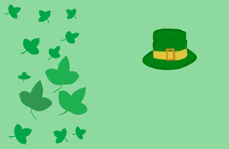 On a green background, a green hat and clover leaves.の写真素材