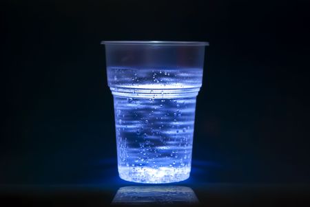 Plastic cup with water  bubblesの写真素材