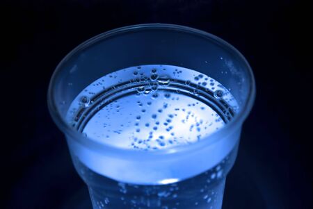 Plastic cup with water  bubblesの写真素材